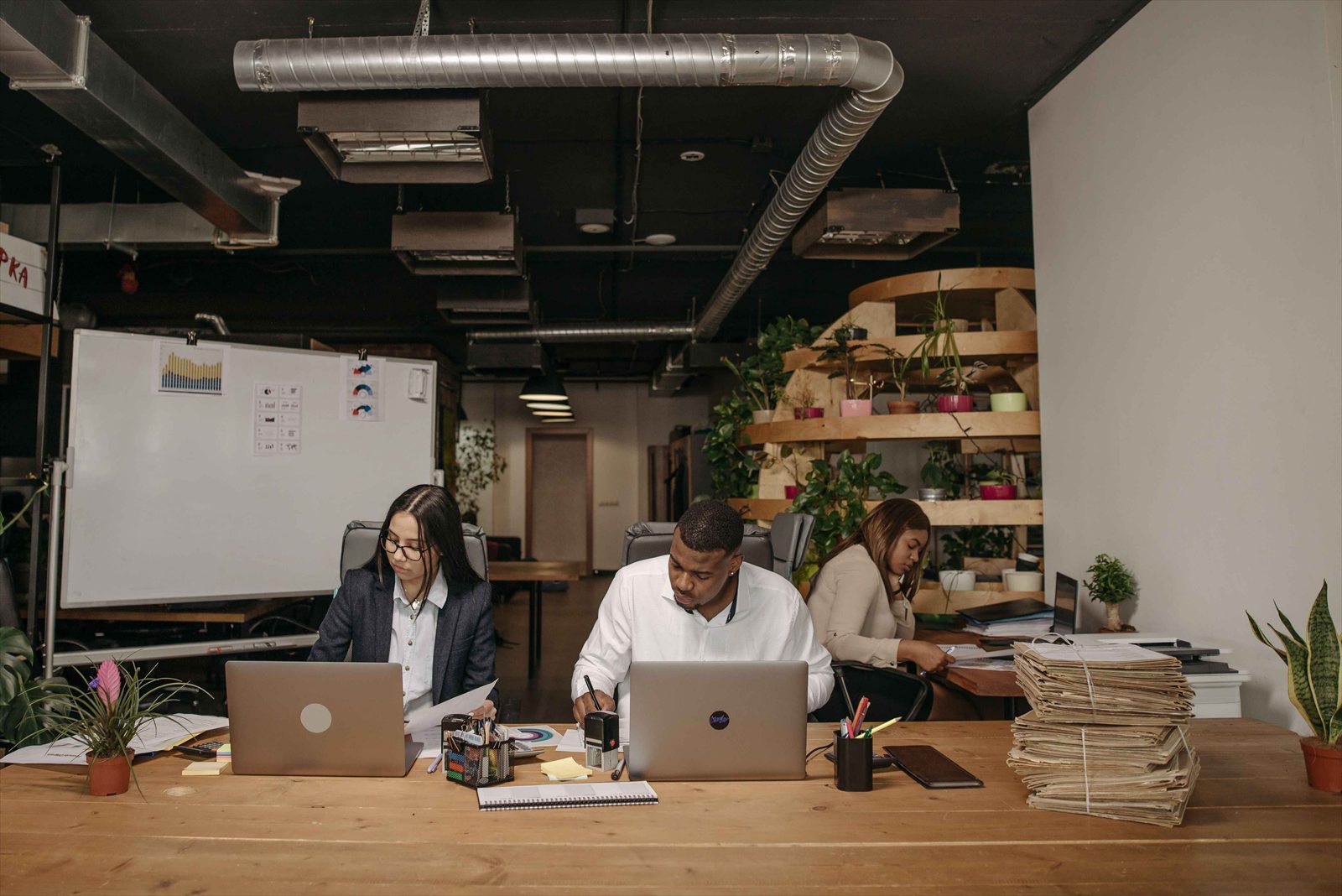 A bright startup workspace with a laptop showing a sales pipeline